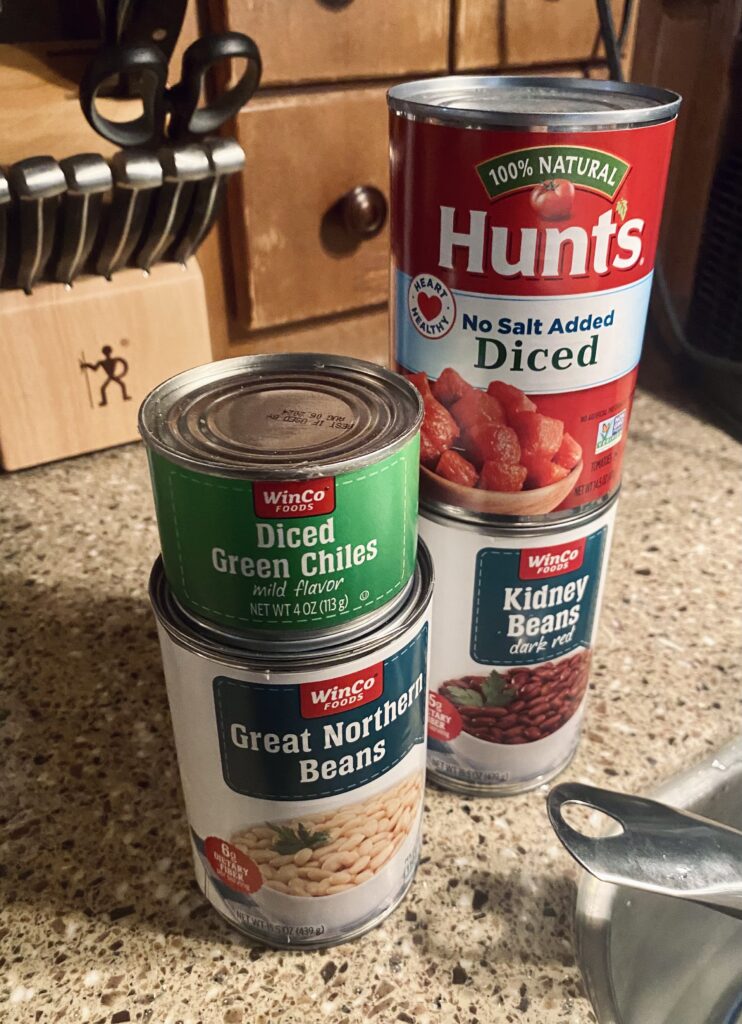 Canned ingredients for white chicken chili.